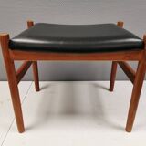 Danish designed footstool in teak wood and black skai “imitation leather”