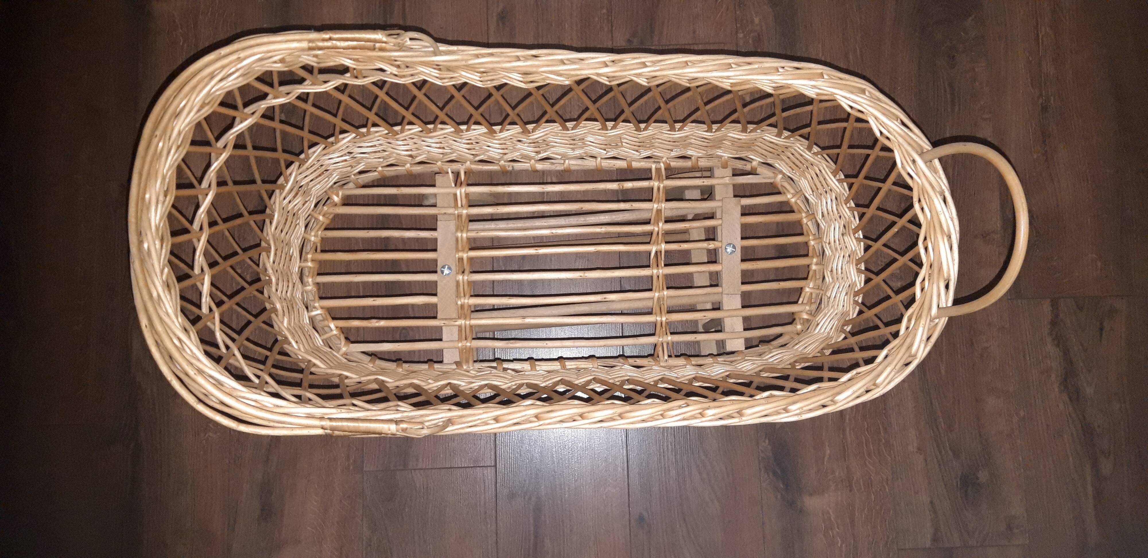 Vintage wicker cradle with wheels