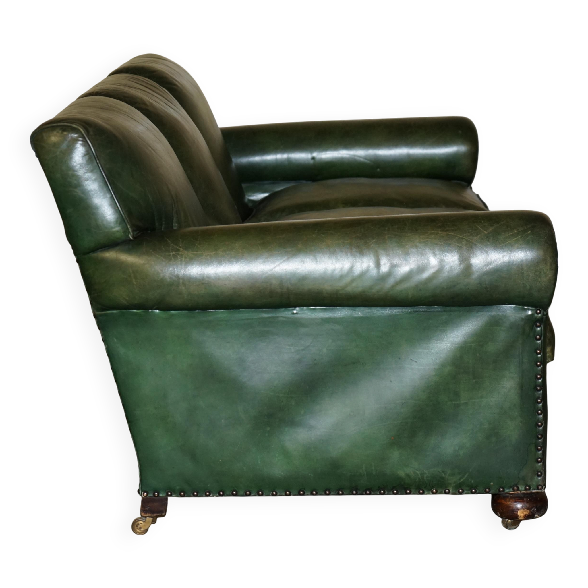 Victorian leather canapé, shield armrests, stamped Maple & Co.