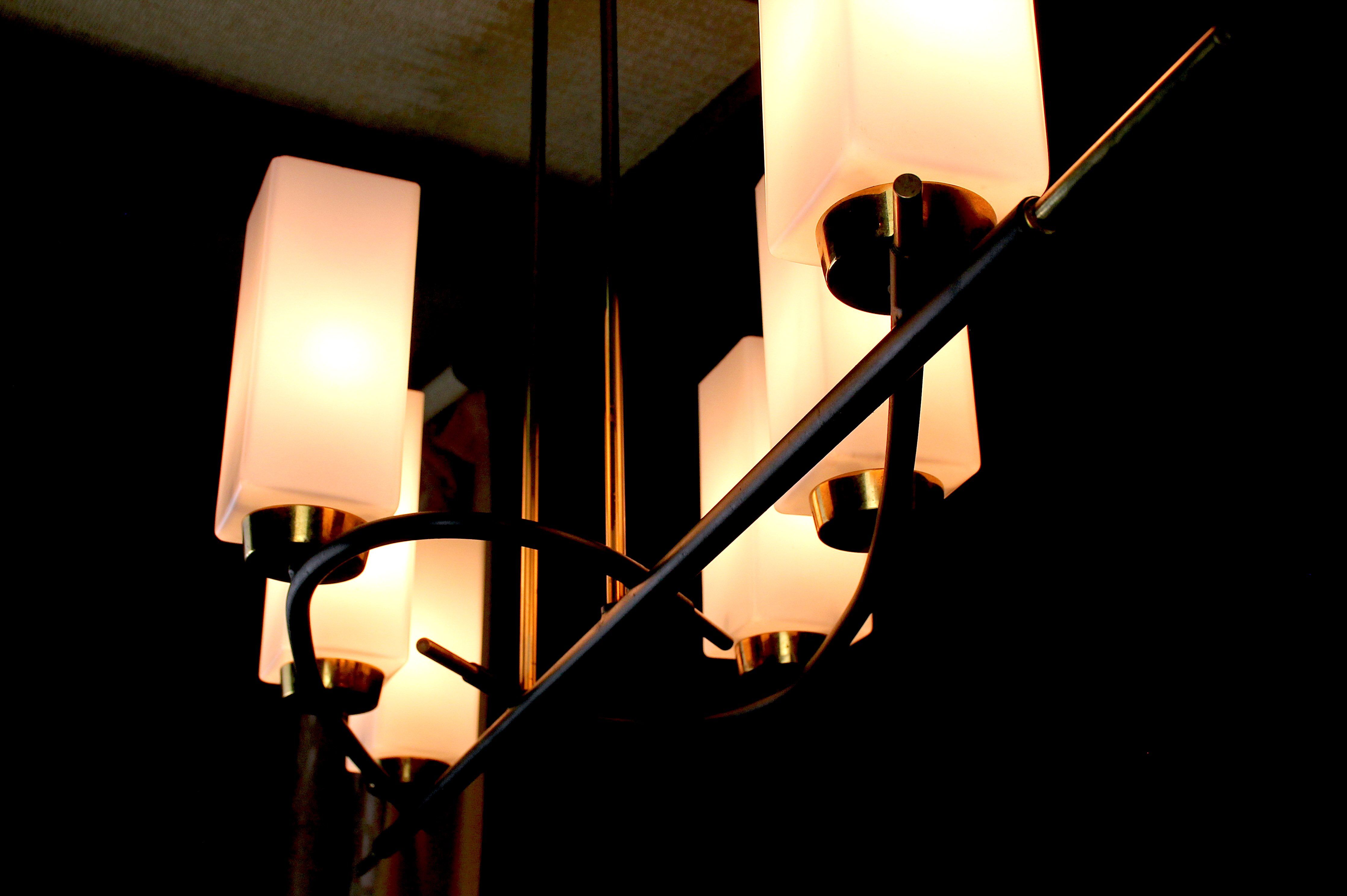 Chandelier of Maison Arlus, in black and gold metal and six rectangular opalines