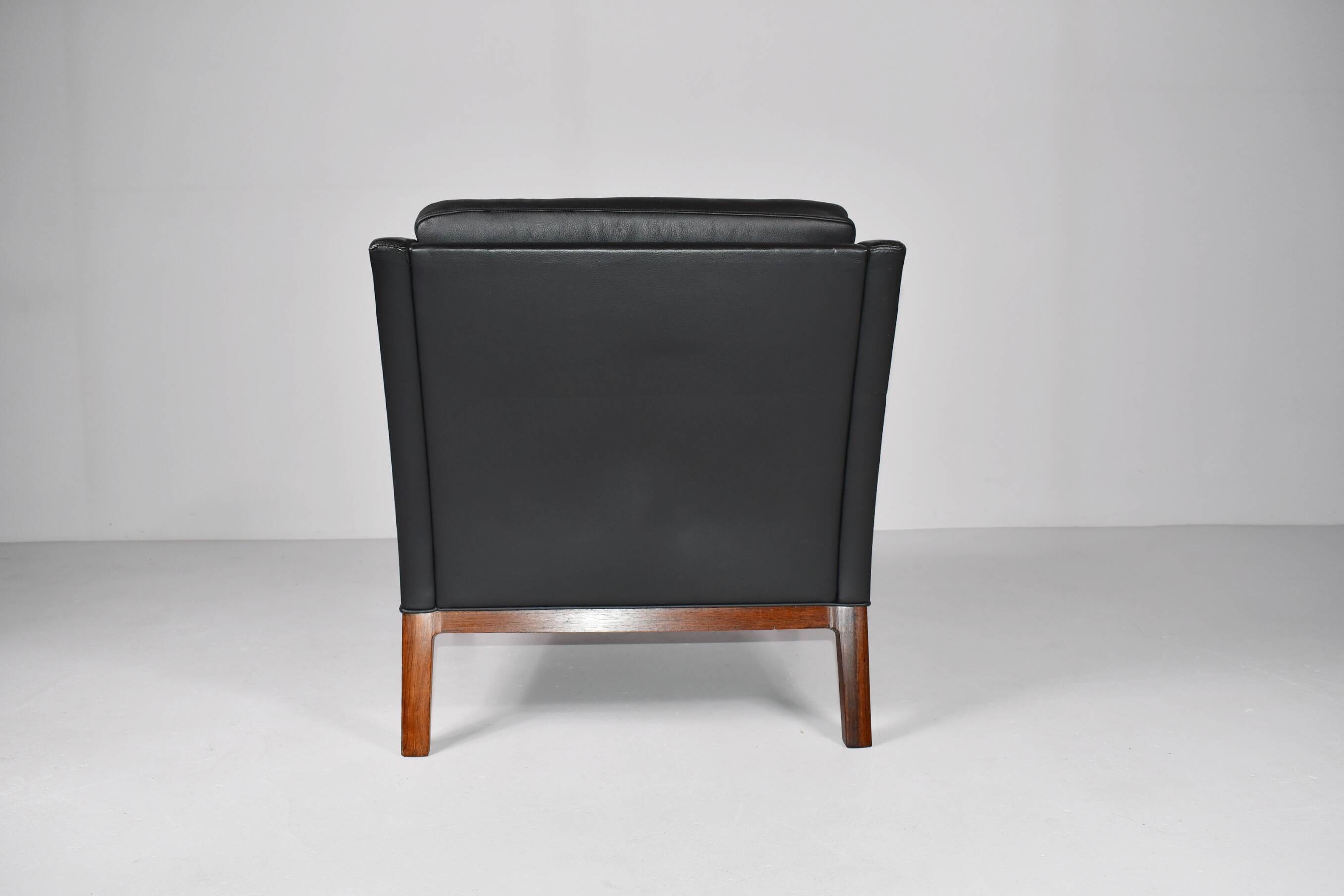 Leather and rosewood armchair by Kai lyngfeldt-Larsen. Denmark