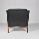 Leather and rosewood armchair by Kai lyngfeldt-Larsen. Denmark