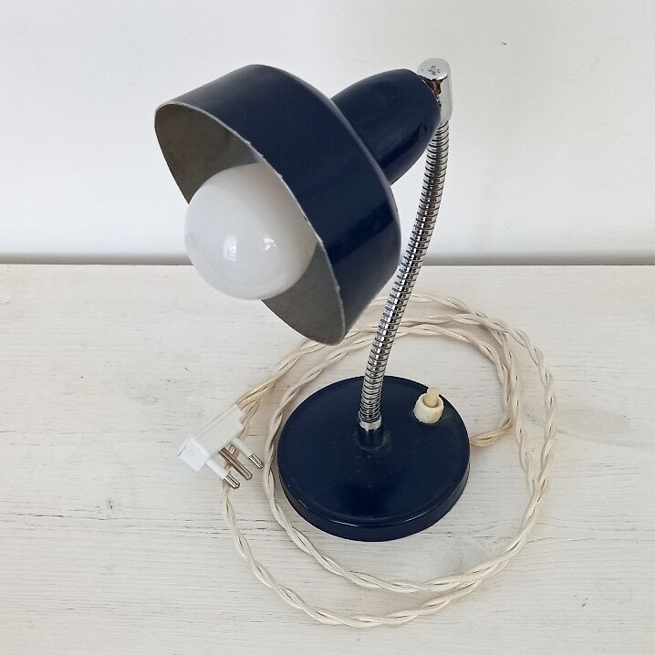 Flexible bedside lamp in blue lacquered sheet metal and stainless steel, edition of the 70s.
