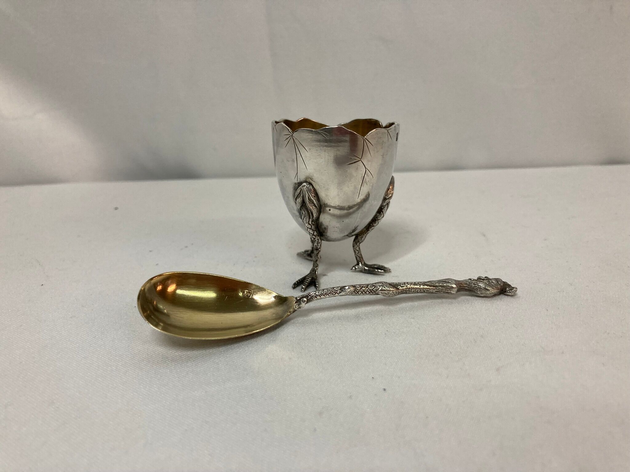 Eggcup feet and silver spoon punches early twentieth century