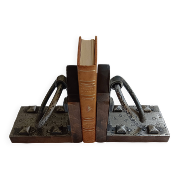 Medieval-style bookends, antique door handle.