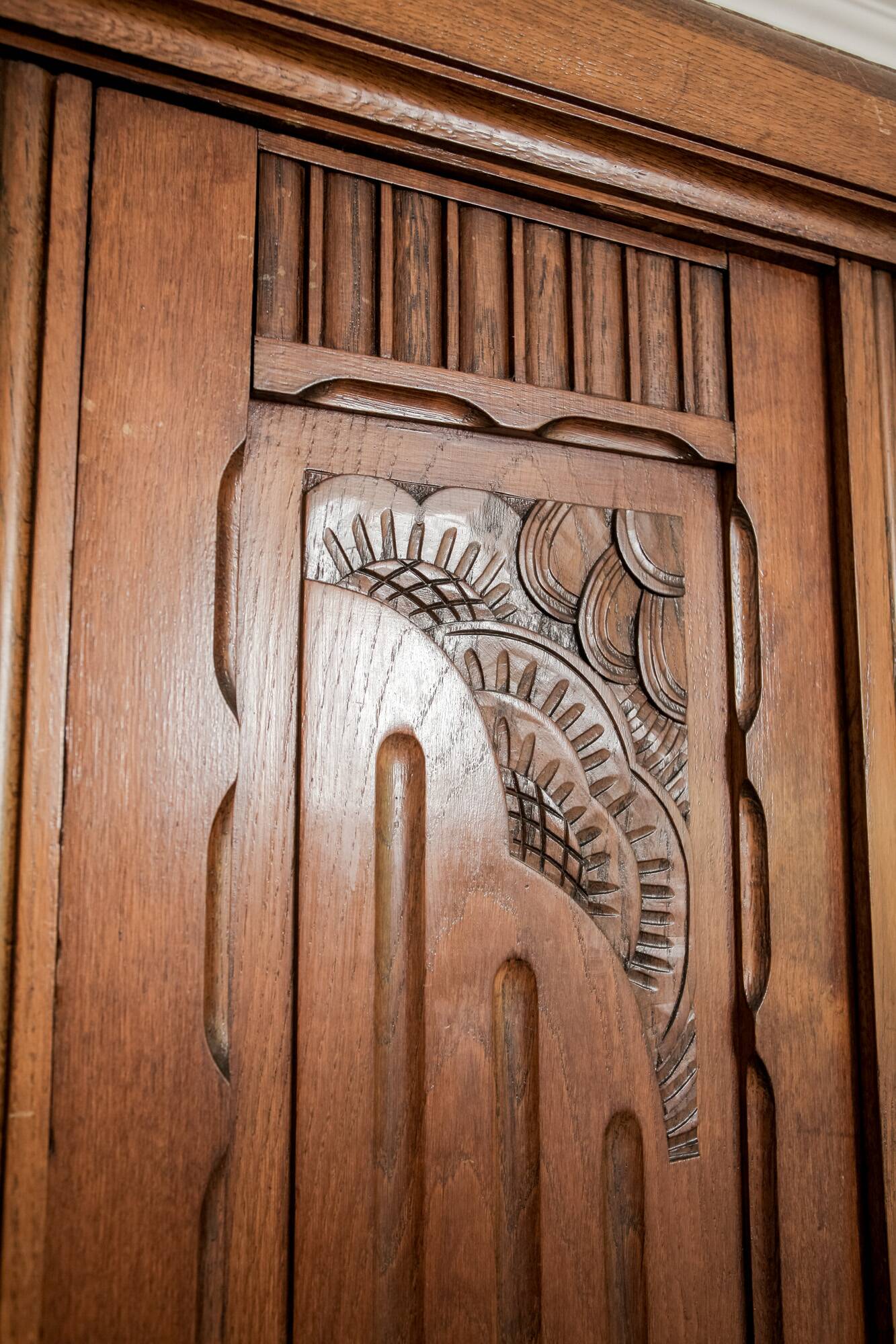 Old solid wood wardrobe with three vintage mirror doors