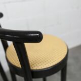 Pair of Baumann Dialog model stools in black and yellow and blue imitation leather, 1990