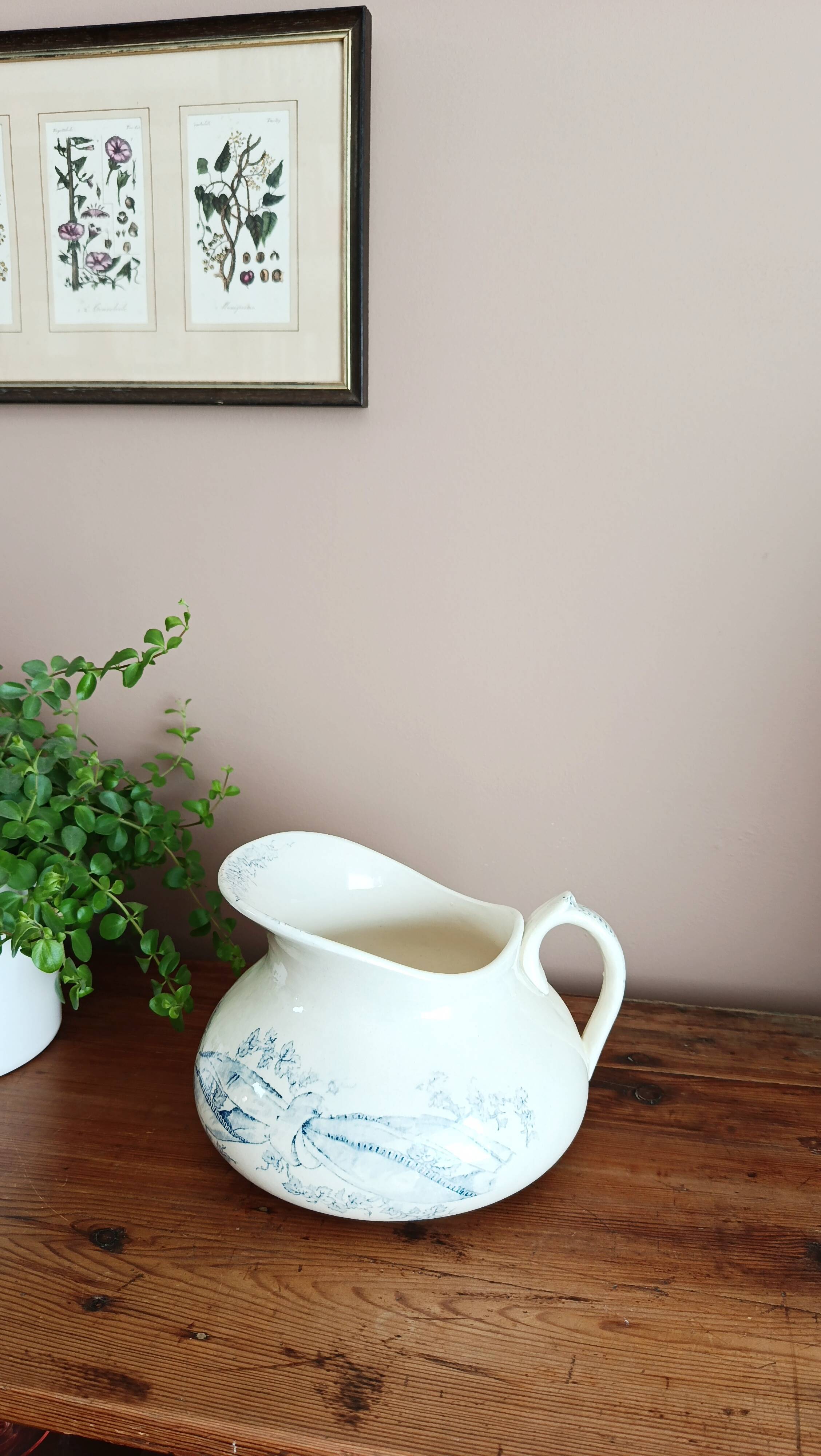 Old bulbous jug in ironstone earthenware