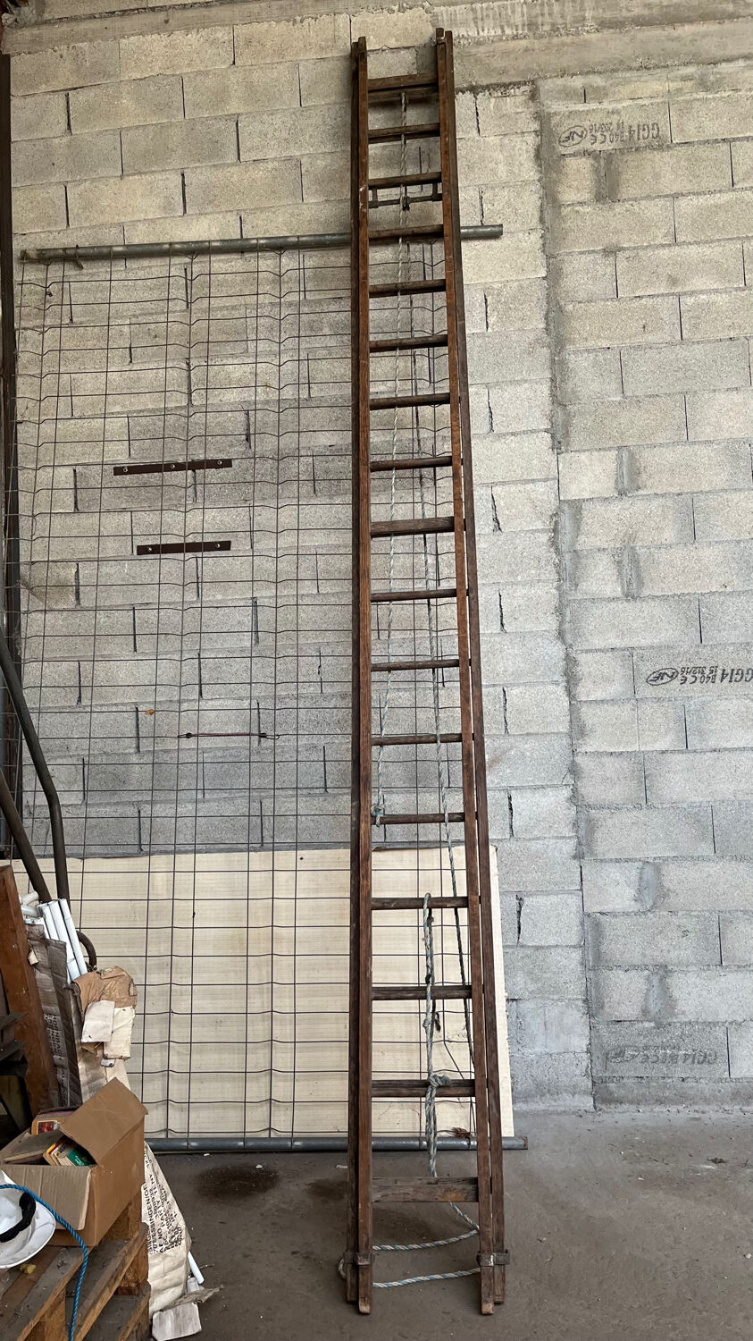 Very large vintage sliding wooden ladder