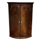 19th-century curved English mahogany corner cabinet.