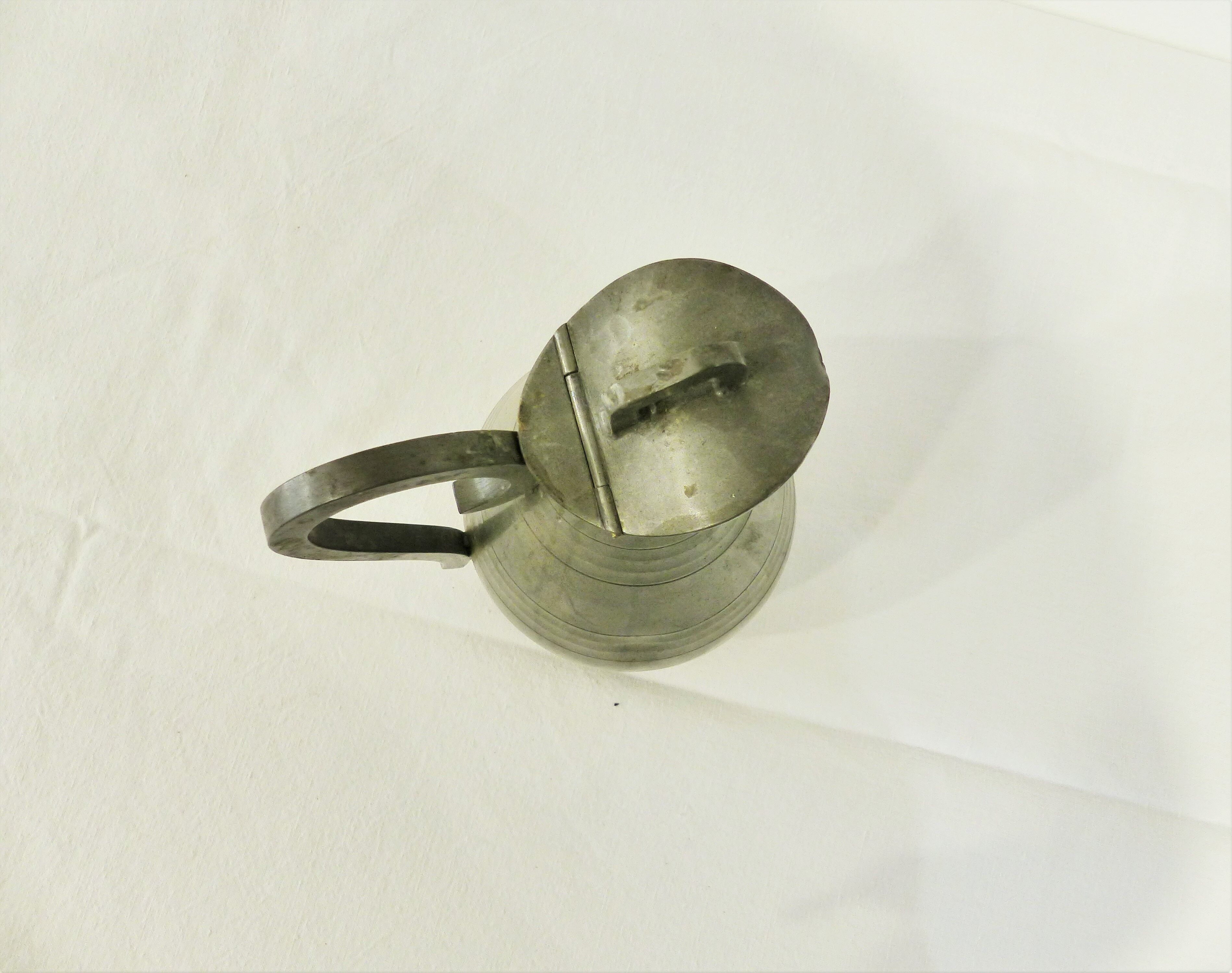 Tin pitcher by J.Despres 20th century