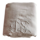 Antique embroidered linen sheet with a monogram.