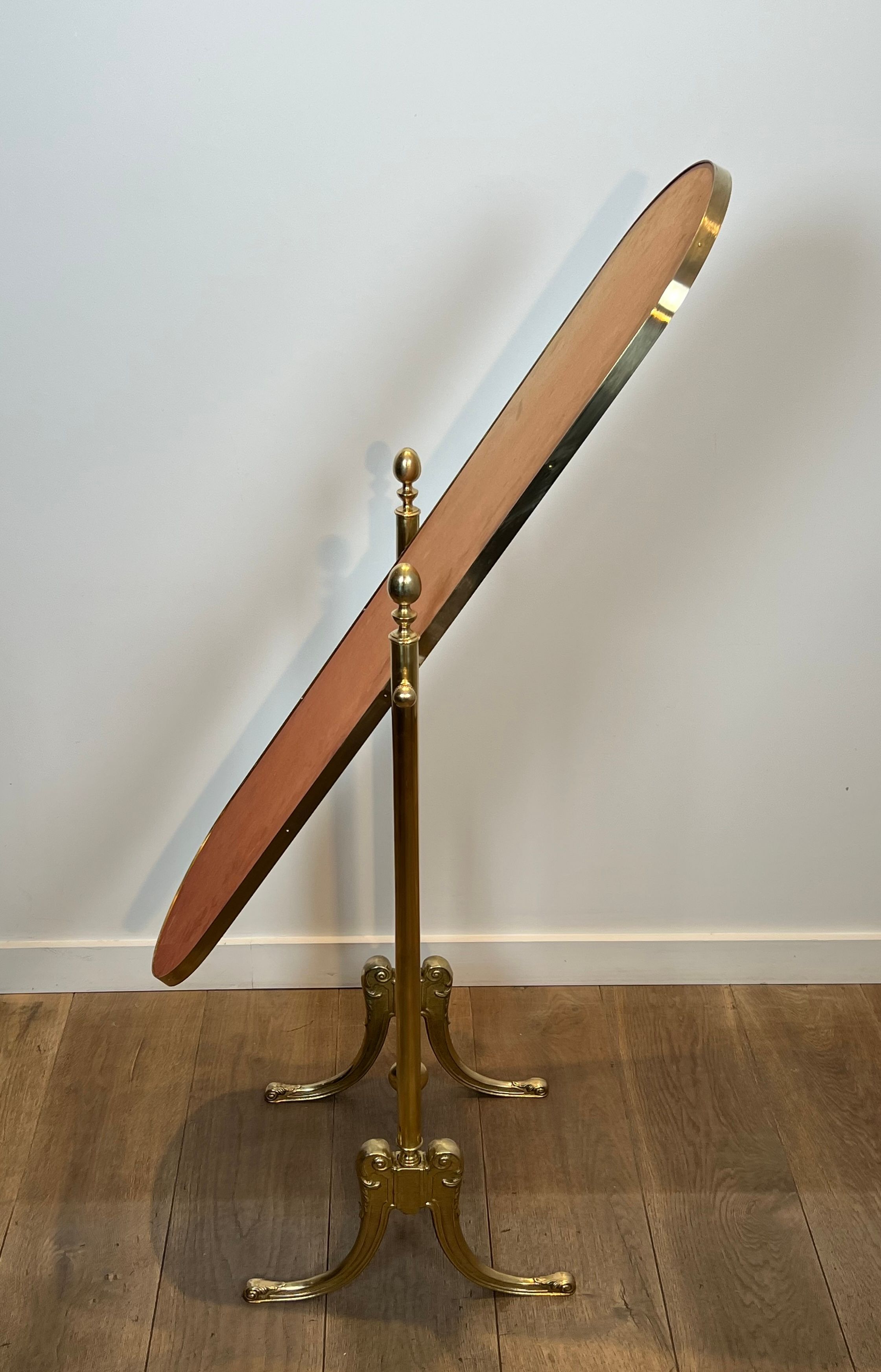 Pair of brass cheval mirrors in neoclassical style