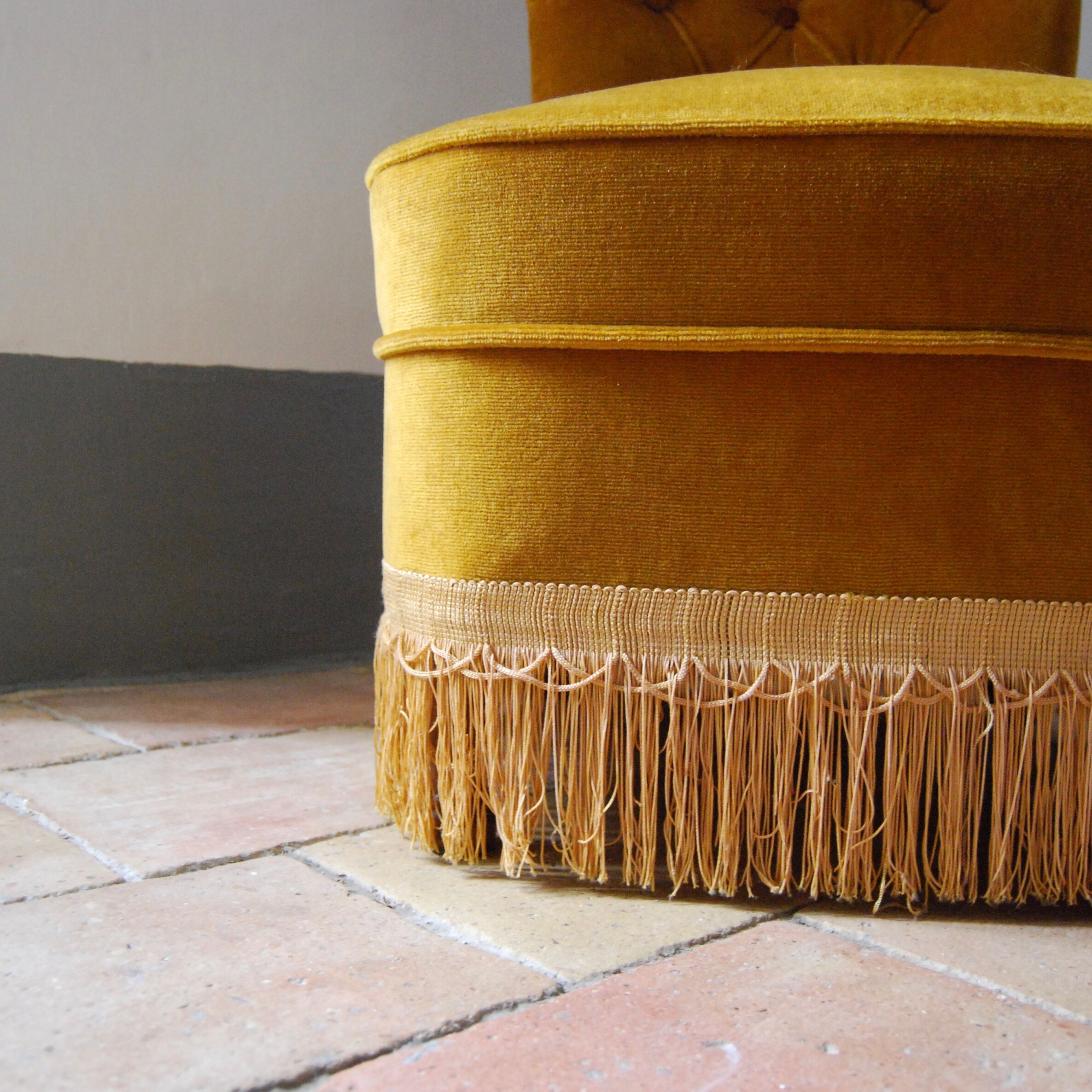 Toad in yellow velvet armchair
