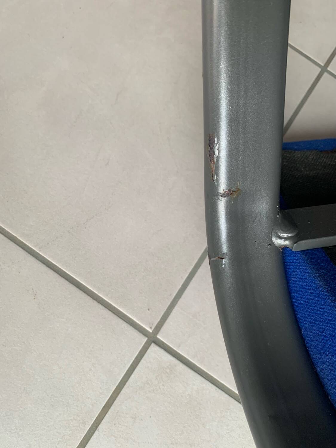 Black metal design armchair with blue fabric. 1980s.