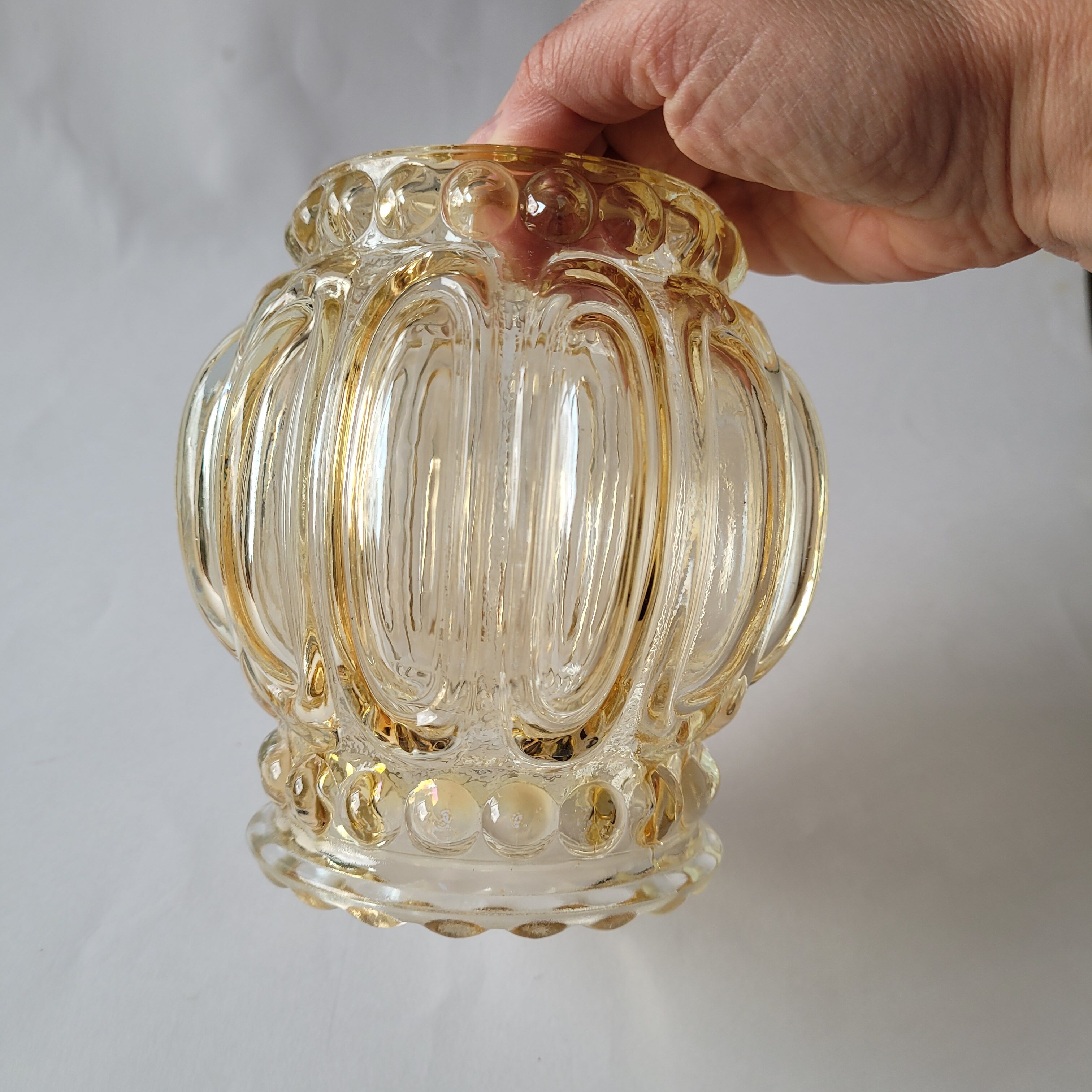 Yellow molded glass globe