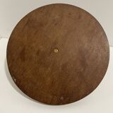 Vintage round wooden cheese board covered with glass plate with foldable handle