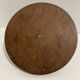 Vintage round wooden cheese board covered with glass plate with foldable handle