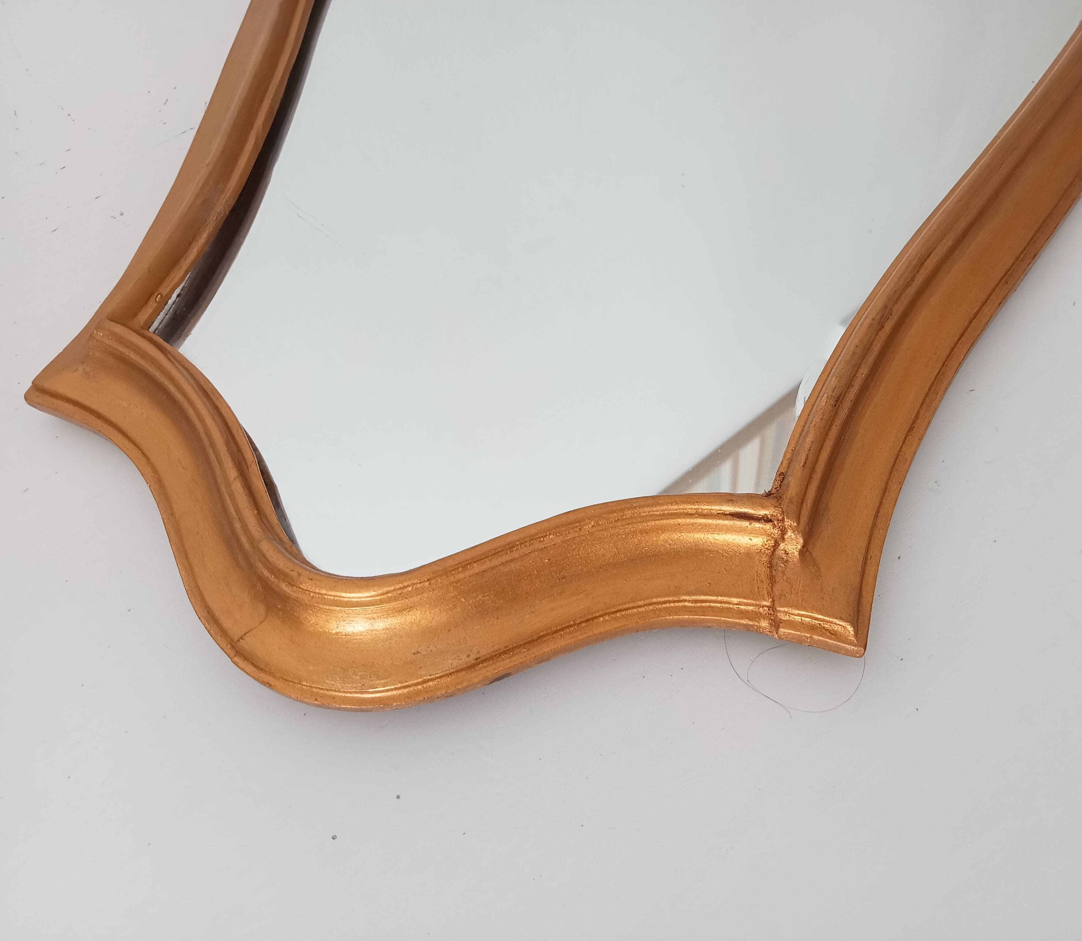 Vintage baroque mirror in gilded wood