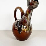 Large bird jug with high neck and handle, signed under the base