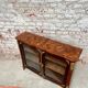 Low showcase in rosewood veneer of the regency xviii th century