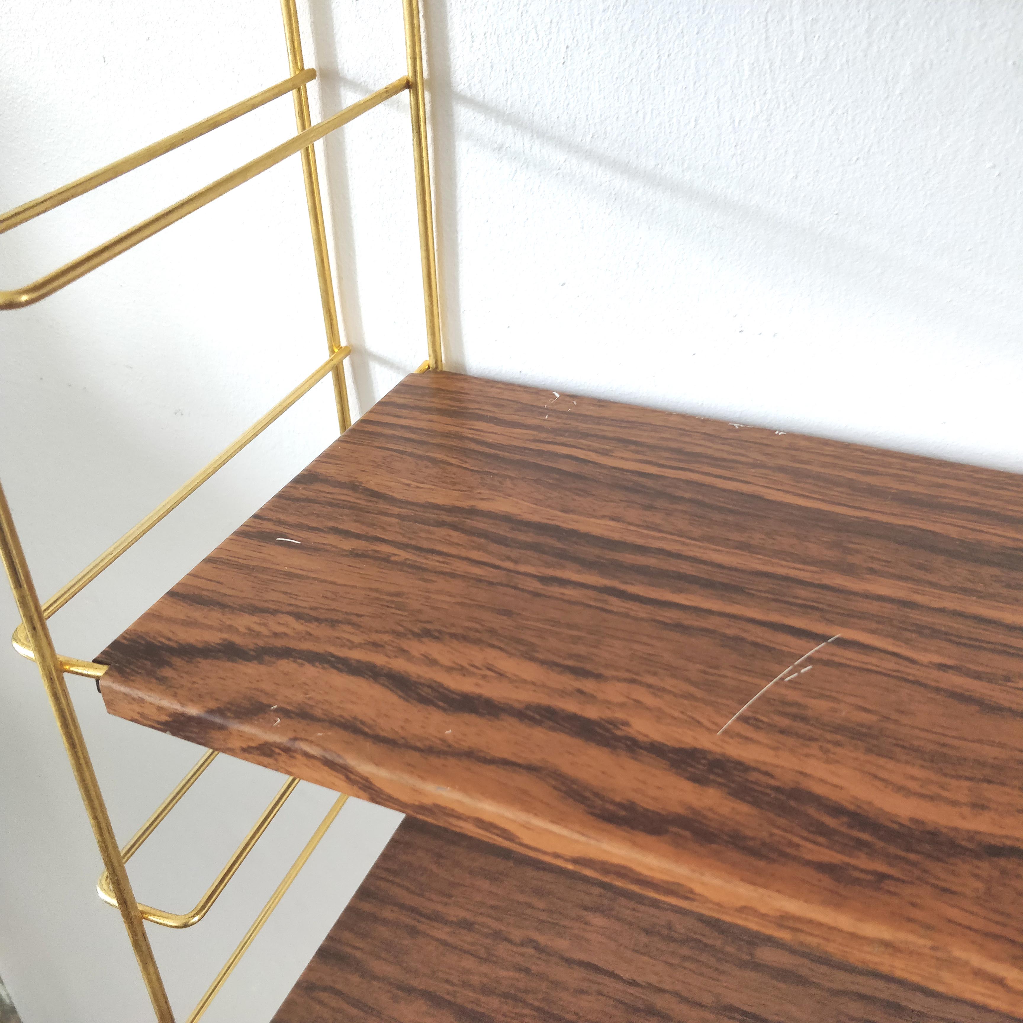 Wood-coloured metal string shelf and gold double studs 1960