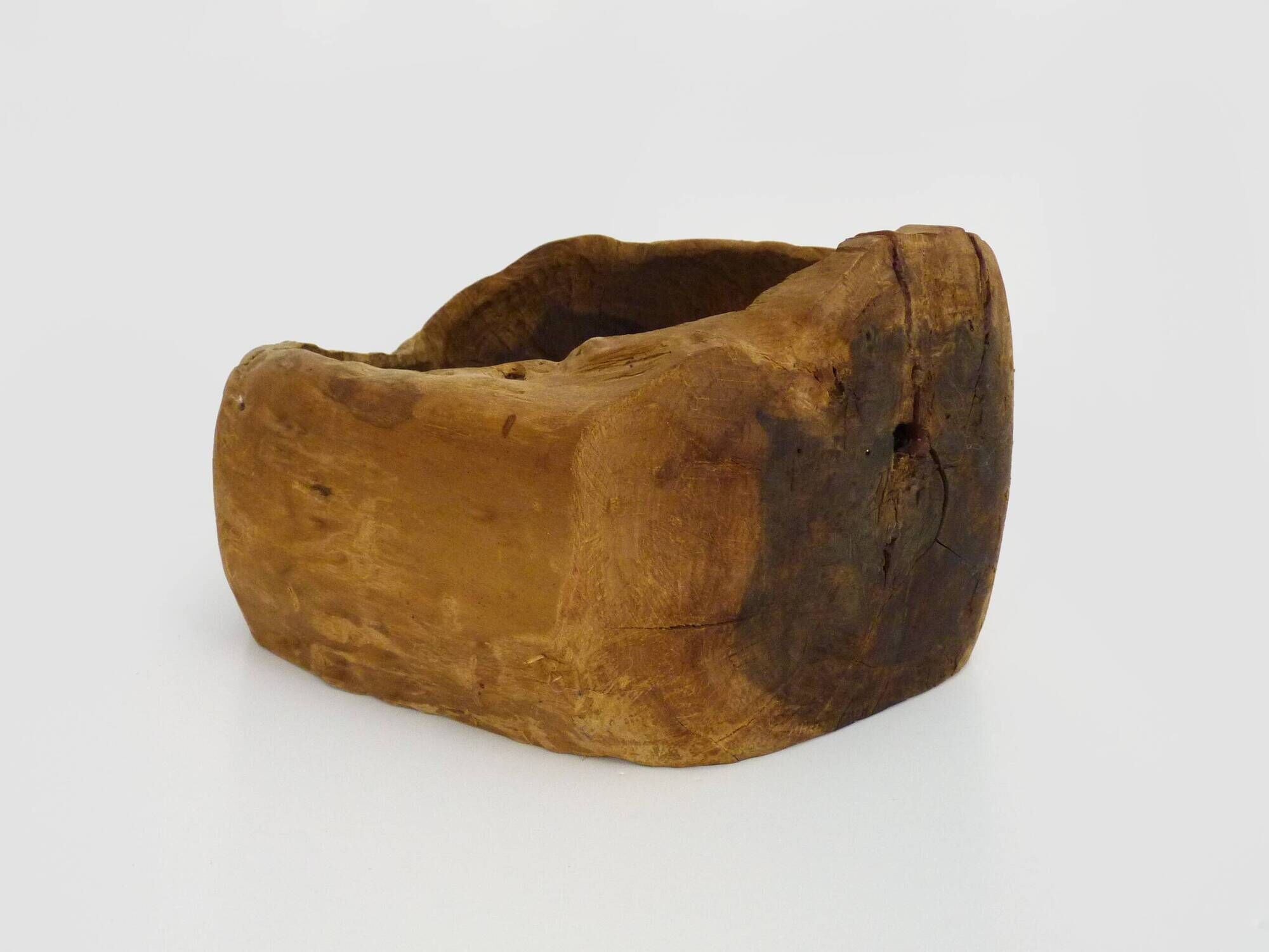 Old wooden farm water trough. Centerpiece, floral decoration. 1950
