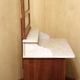 Vintage vanity toilet furniture with marble top.