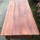 Old farmhouse table with cherry and chestnut panels with 3 drawers.