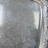 Vintage silver-plated metal tray with handles and embossed pattern