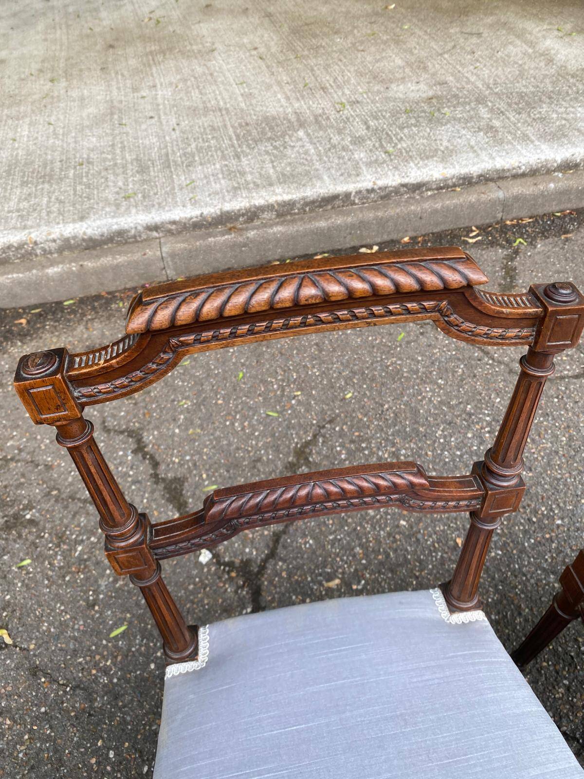 2 Louis XVI period chairs in solid wood and grey fabric.