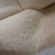 Womb Chair and Ottoman in fluffy white fabric by Eero Saarinen