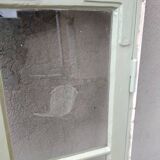Old window mounted as a fenestron