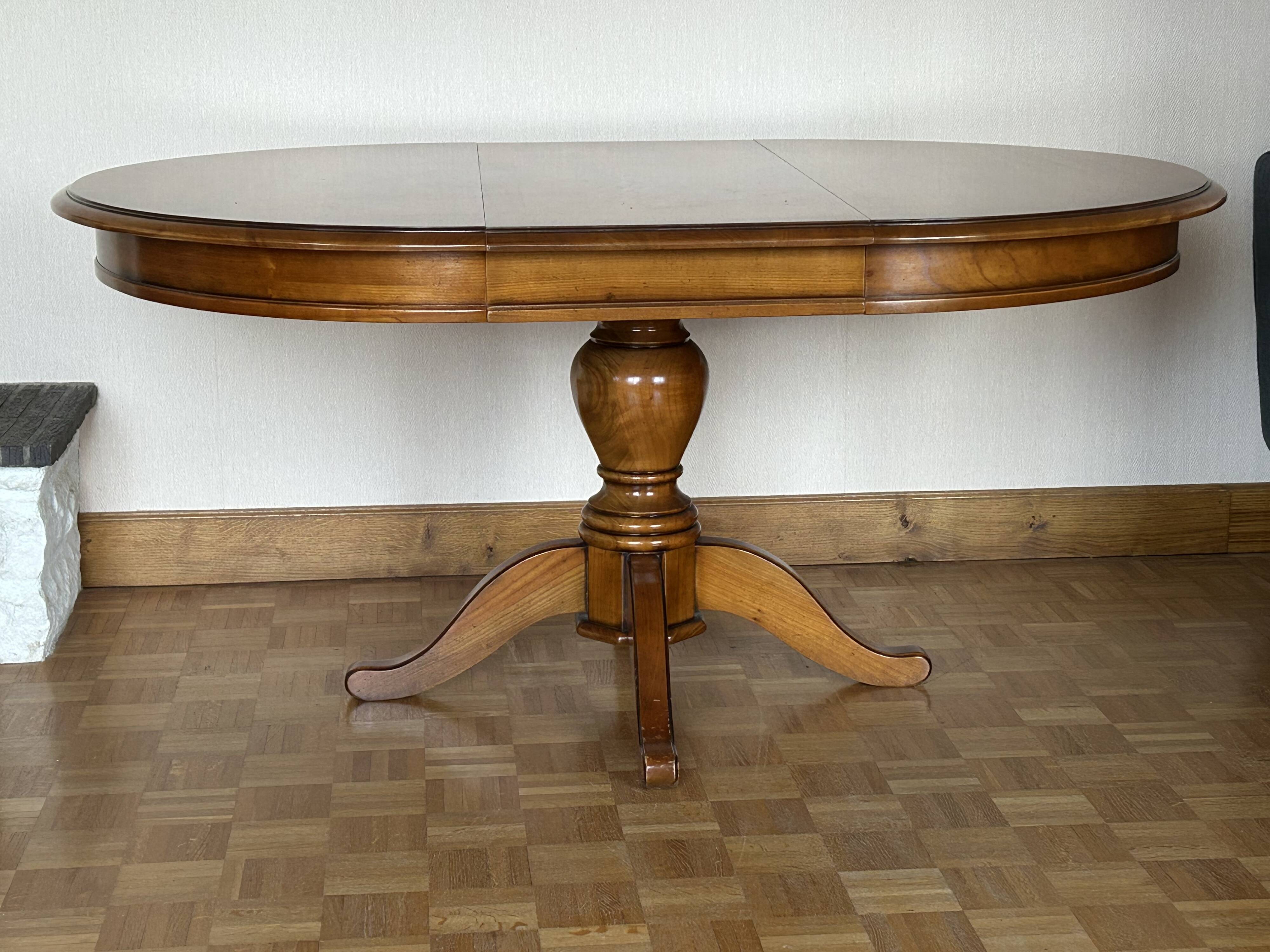 Louis Philippe solid cherry table with 2 extensions.