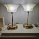 Art Deco table lamps with frosted glass shade and brass base.