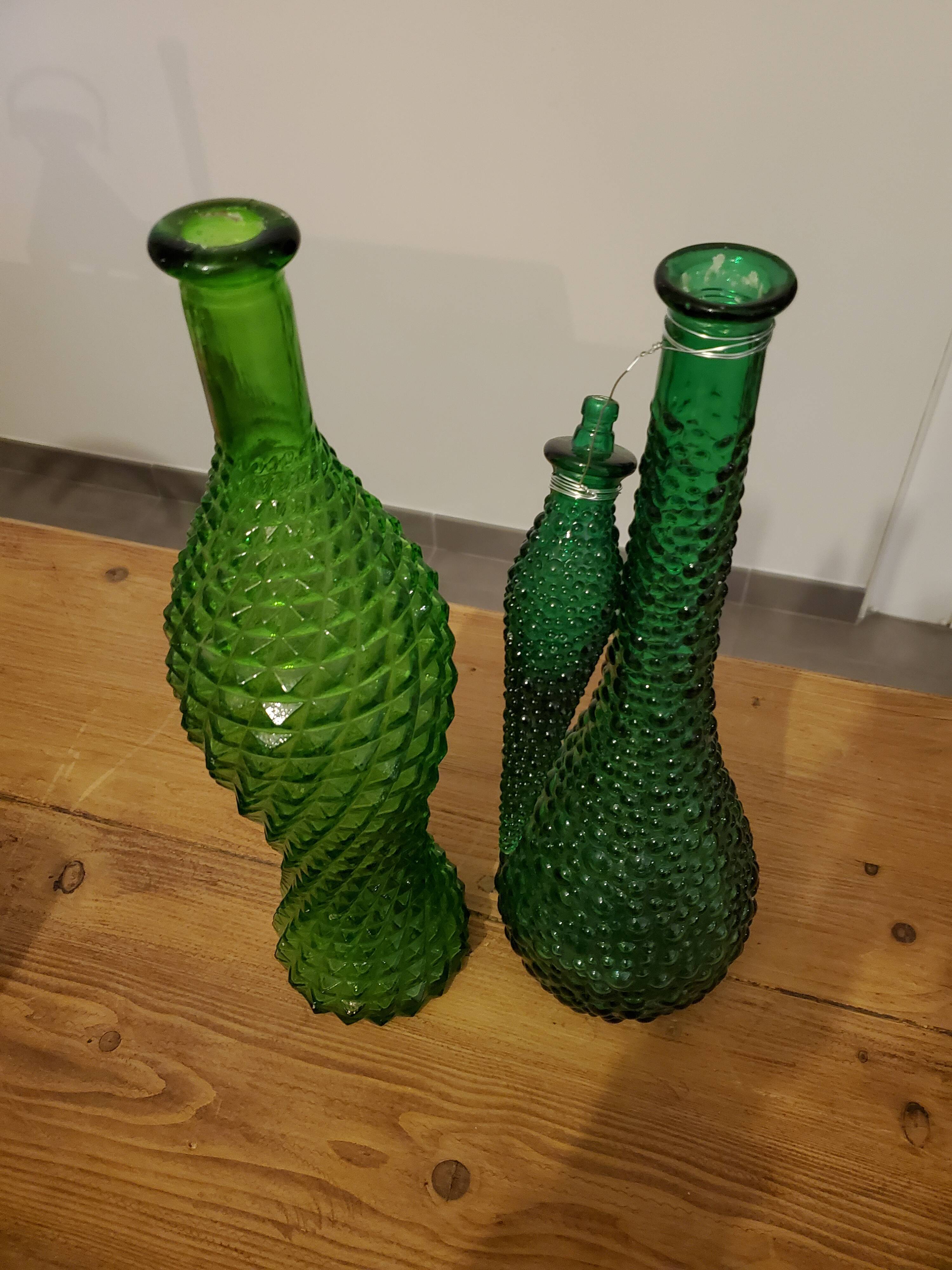 Set of green bubble glass bottles