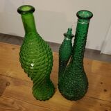 Set of green bubble glass bottles
