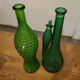 Set of green bubble glass bottles