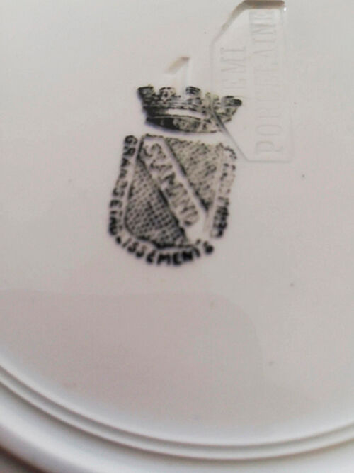 Old vintage dessert plate with drawing and phrase "swimming"