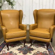Pair of 1980s English wingback armchairs in leather.