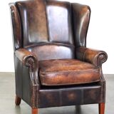 Fauteuil à oreilles en cuir de vache de style anglais avec des couleurs uniques et un excellent confort