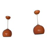 Pair of 70's globes in orange lacquered metal.