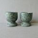 2 marble egg cups in veined white and green, circa 1980.