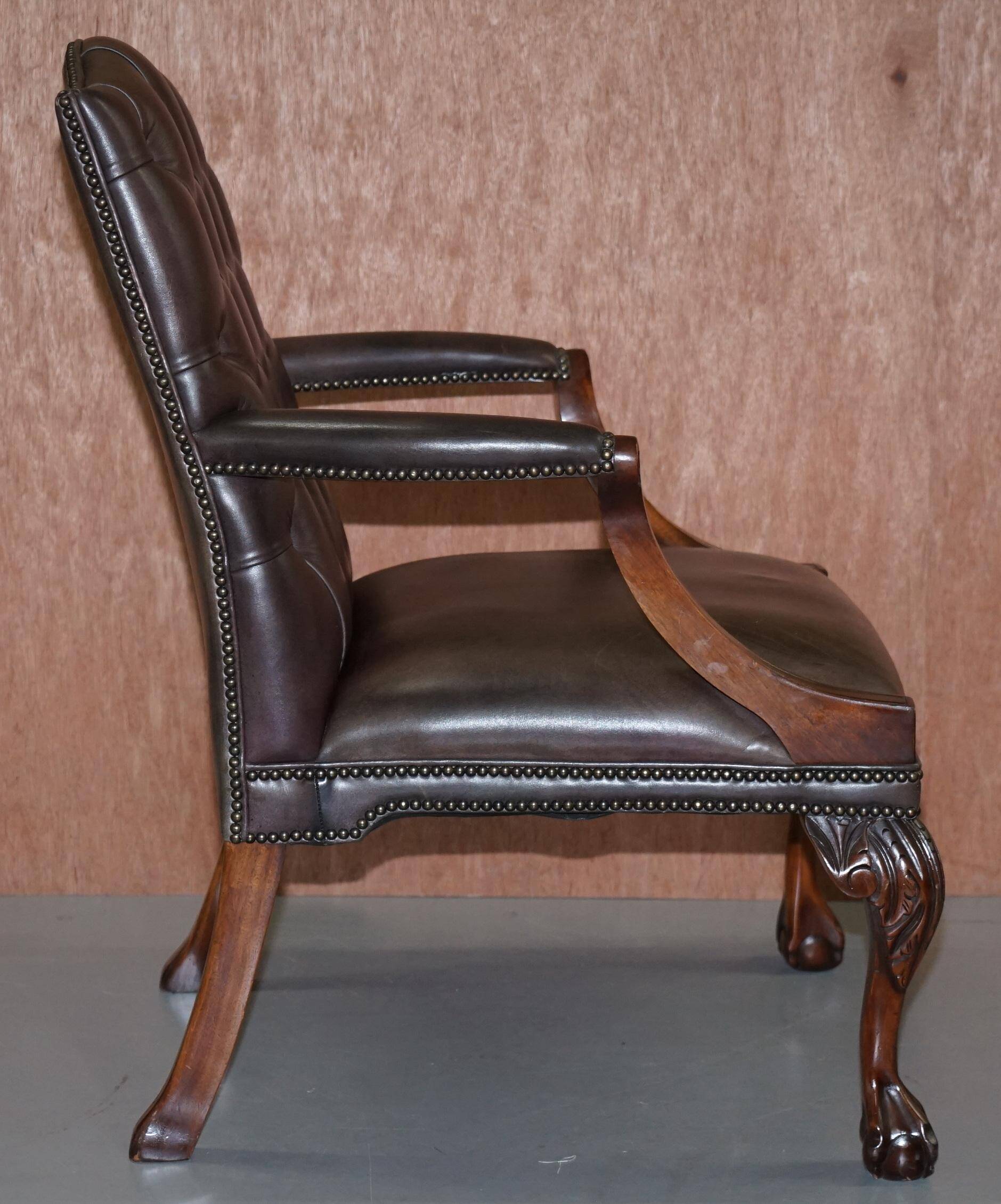 Gainsborough armchair George II leather Chesterfield hand-carved with claw and ball feet.