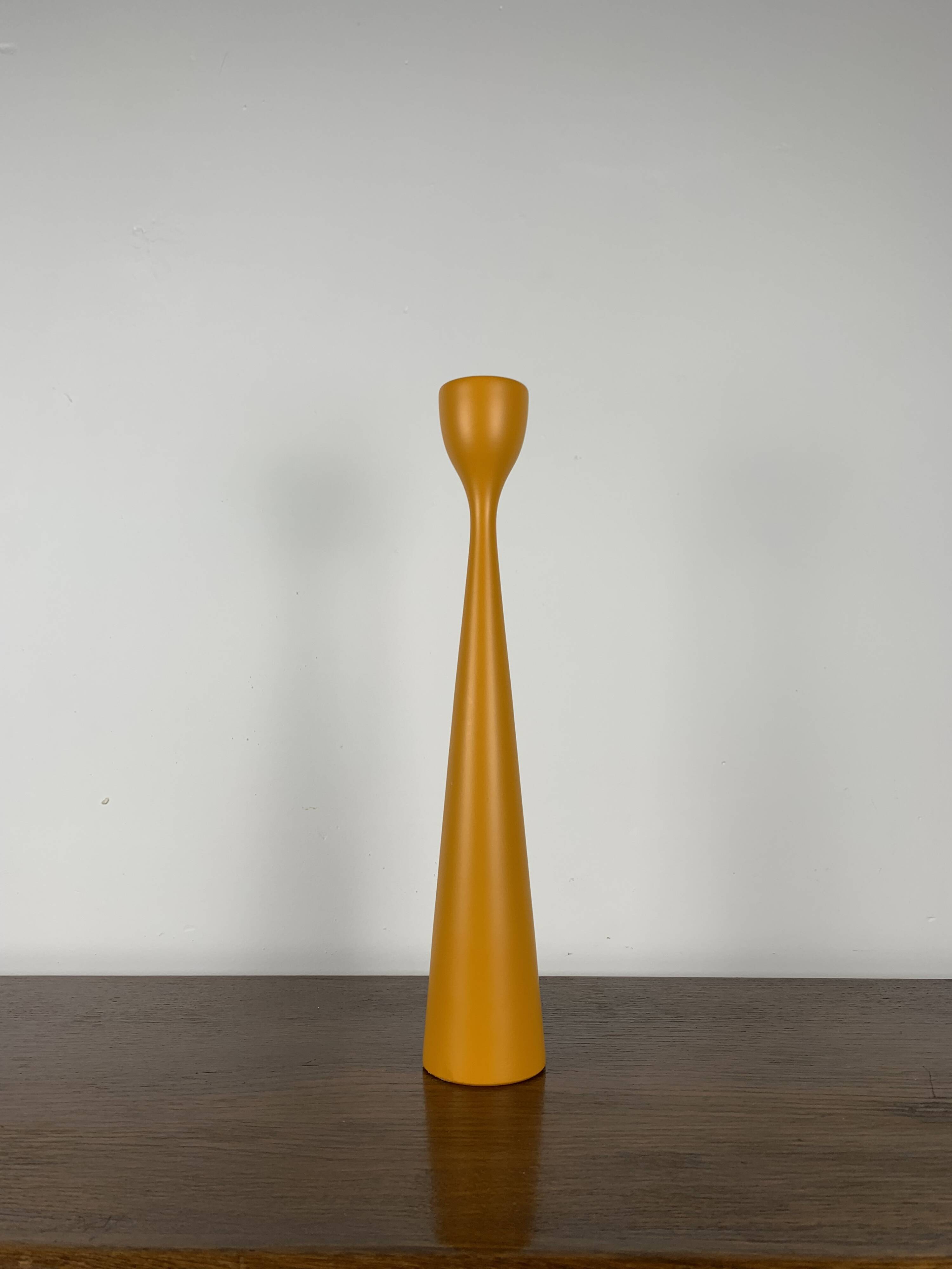 Large candle holder in orange-yellow lacquered wood