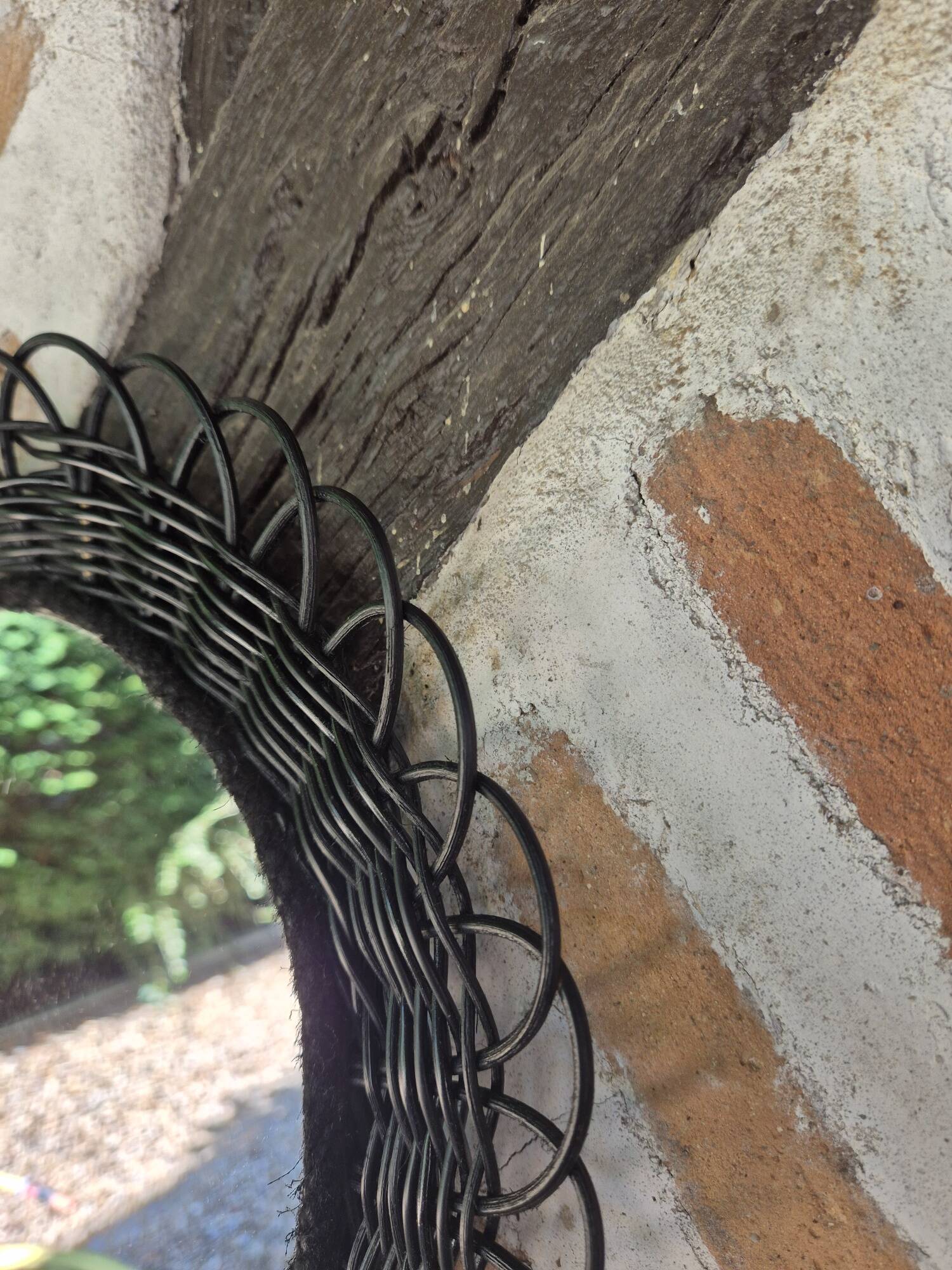 Vintage black rattan flower mirror