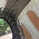 Vintage black rattan flower mirror