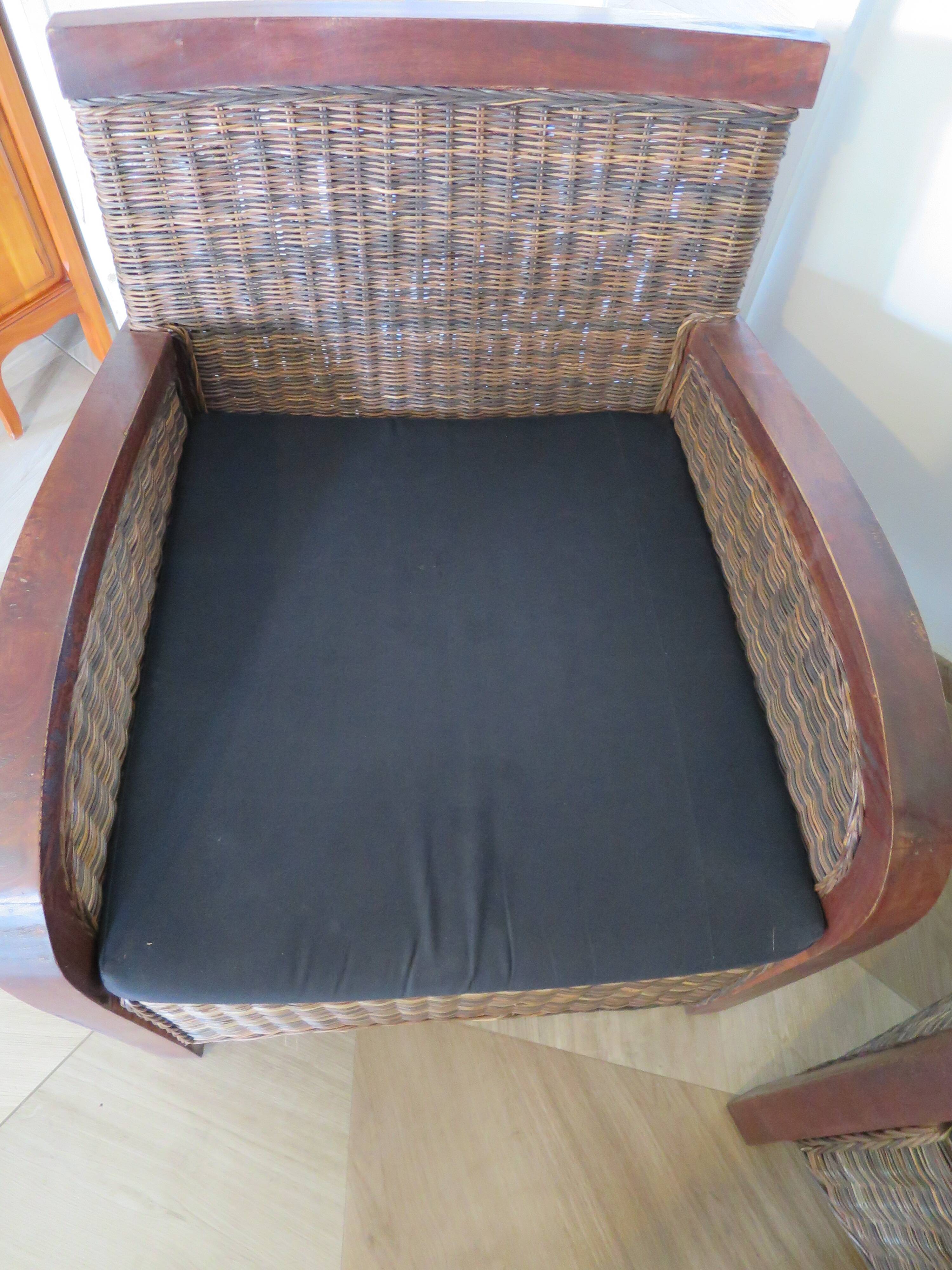 2 colonial-style armchairs in woven rattan and exotic wood