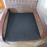 2 colonial-style armchairs in woven rattan and exotic wood