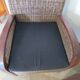 2 colonial-style armchairs in woven rattan and exotic wood